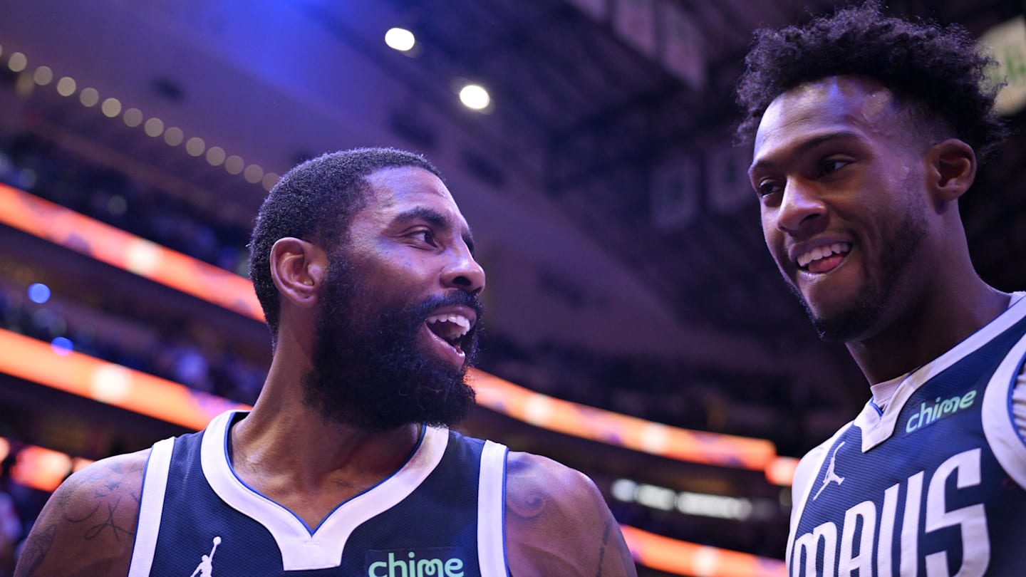 Feb 12, 2025; Dallas, Texas, USA; Dallas Mavericks guard Kyrie Irving (11) and forward Olivier-Maxence Prosper (8) walk off the court after the Mavericks defeat the Golden State Warriors at the American Airlines Center. Mandatory Credit: Jerome Miron-Imagn Images