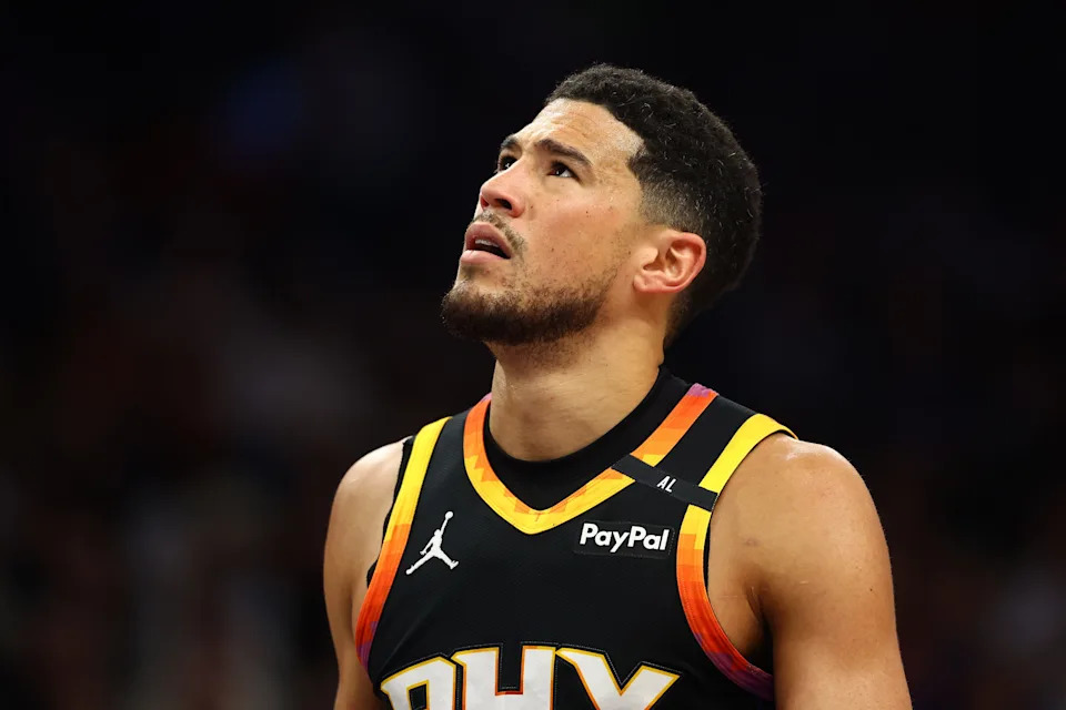 Apr 9, 2025; Phoenix, Arizona, USA; Phoenix Suns guard Devin Booker (1) reacts after a play against the Oklahoma City Thunder during the first half at Footprint Center. Mandatory Credit: Mark J. Rebilas-Imagn Images