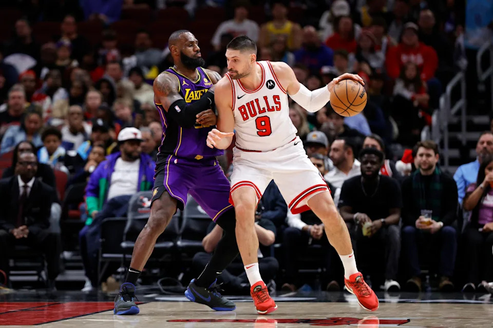 Los Angeles Lakers forward LeBron James (23) and Chicago Bulls center Nikola Vucevic (9).