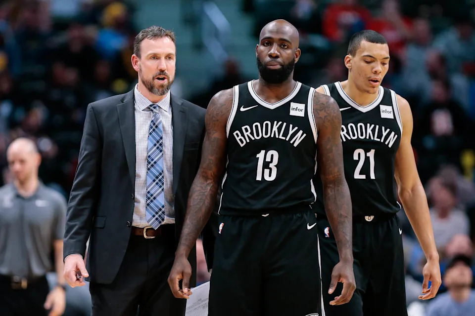 Nov 7, 2017; Denver, CO, USA; Brooklyn Nets assistant coach Chris Fleming talks with forward Quincy Acy (13) and forward Jacob Wiley (21) in the second quarter against the Denver Nuggets at the Pepsi Center. Mandatory Credit: Isaiah J. Downing-USA TODAY Sports