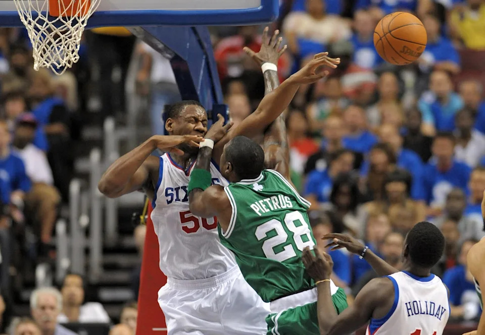 May 23, 2012; Philadelphia, PA USA; Philadelphia 76ers power forward Lavoy Allen (50) fouls Boston Celtics small forward Mickael Pietrus (28) during the second quarter of game six of the Eastern Conference semifinals of the 2012 NBA Playoffs at the Wells Fargo Center. Mandatory Credit: Eric Hartline-USA TODAY Sports