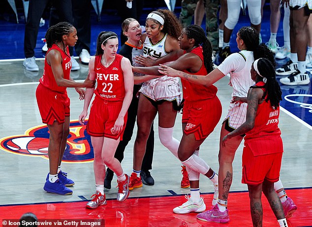 Angel Reese attempts to confront Clark during a game between the Fever and the Sky in May