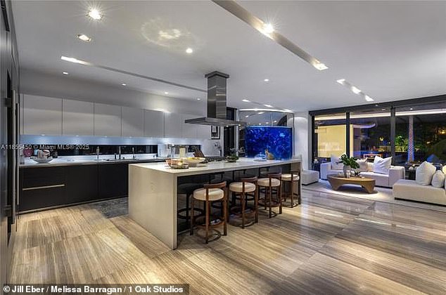 Inside, the five-bedroom home features polished marble and hardwood floors