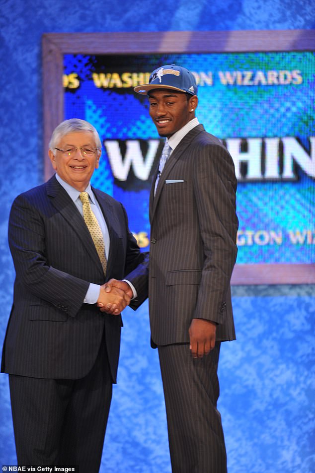 John Wall shakes hands with NBA Commissioner David Stern after being selected first