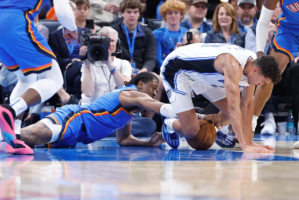 Nov 4, 2024; Oklahoma City, Oklahoma, USA; Oklahoma City Thunder forward Jalen Williams (8) and Orlando Magic forward Tristan da Silva (23) fight for a loose ball during the second half at Paycom Center. Mandatory Credit: Alonzo Adams-Imagn Images