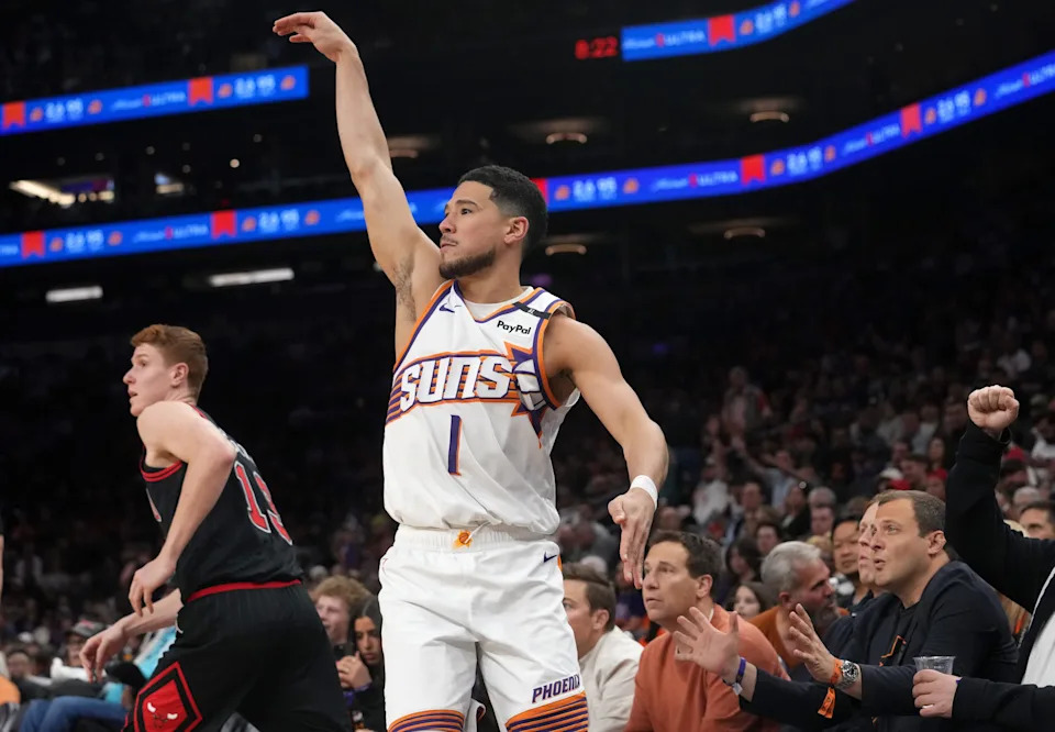 Phoenix Suns guard Devin Booker (1) watches his 3-point shot against the Chicago Bulls at PHX Arena in Phoenix on Wednesday, March 19, 2025.
