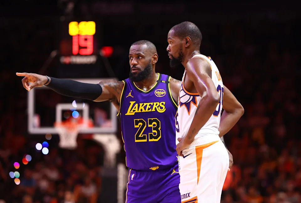 Oct 28, 2024; Phoenix, Arizona, USA; Los Angeles Lakers forward LeBron James (23) against Phoenix Suns forward Kevin Durant (35) at Footprint Center. Mandatory Credit: Mark J. Rebilas-Imagn Images
