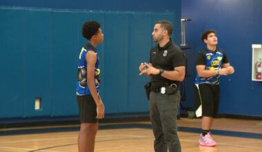 Tampa police officers build bonds with youth in summer basketball league