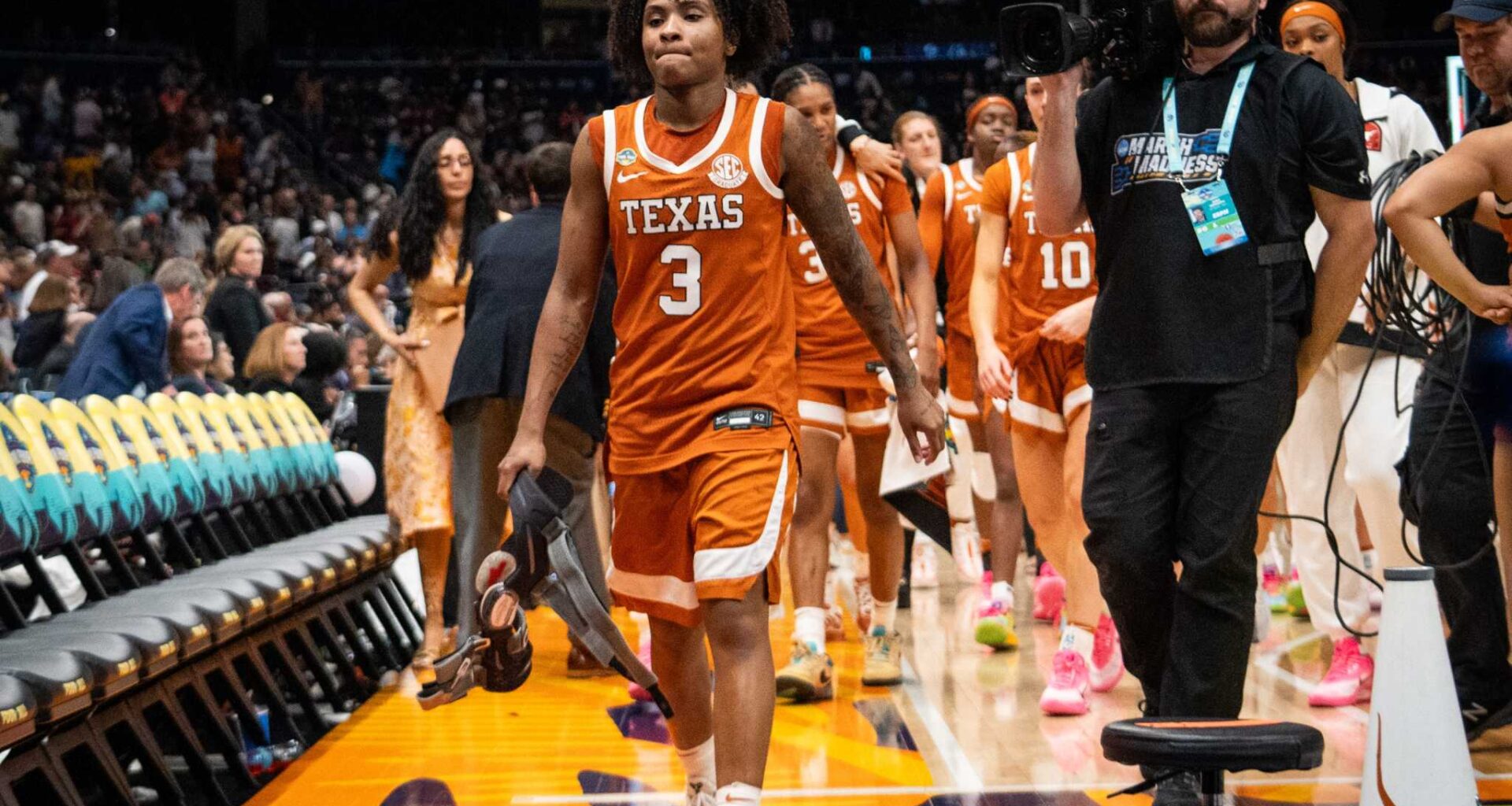 Texas Longhorns guard Rori Harmon (3) drives past defense from TCU Horned Frogs guard Agnes Emma-Nnopu (21) in the second half of the Longhorns' NCAA Playoff Regional final game against the TCU Horned Frogs at Legacy Arena in Birmingham Alabama, March 31, 2025.