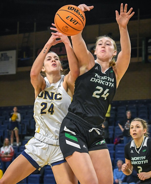 University of Northern Colorado sophomore Tatum West, left, fights for the rebound while playing North Dakota at Bank of Colorado Arena on Saturday Dec. 7, 2024.(Jim Rydbom/Staff Photographer)