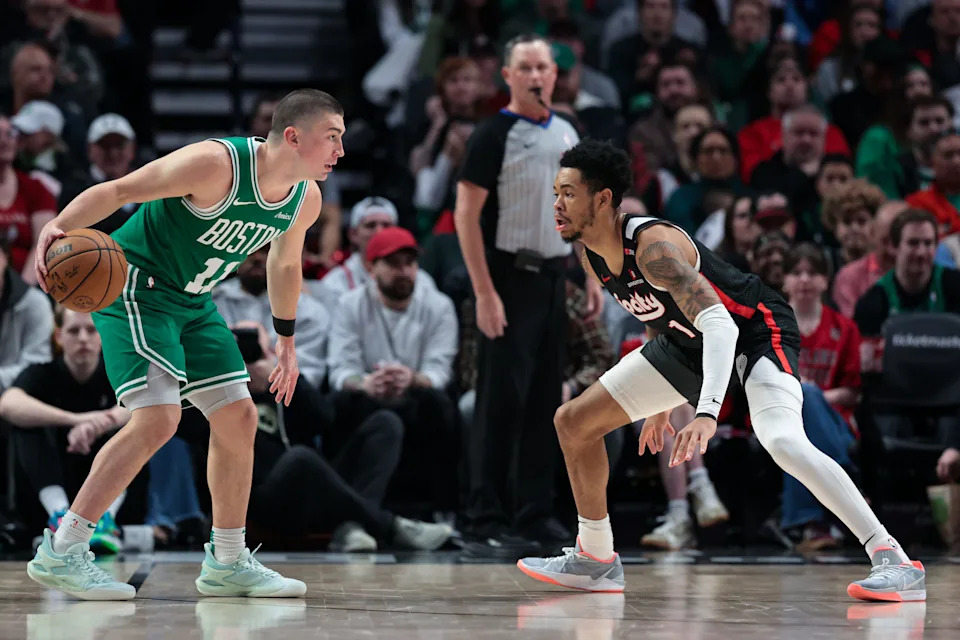 PORTLAND, OREGON - MARCH 23: Payton Pritchard #11 of the Boston Celtics dribbles against Anfernee Simons #1 of the Portland Trail Blazers during the second quarter at the Moda Center on March 23, 2025 in Portland, Oregon. NOTE TO USER: User expressly acknowledges and agrees that, by downloading and or using this photograph, User is consenting to the terms and conditions of the Getty Images License Agreement. (Photo by Rio Giancarlo/Getty Images)