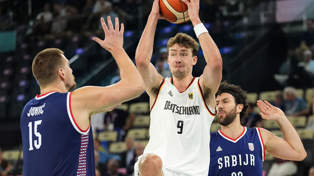 Germany guard Franz Wagner (9) drives to the basket against Serbia power forward Nikola Jokic (15) in the men's basketball bronze medal game during the Paris 2024 Olympic Summer Games at Accor Arena.