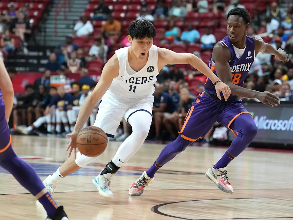 Jul 17, 2022; Las Vegas, NV, USA; Indiana Pacers forward Fanbo Zeng (11) dribbles against Phoenix Suns guard Brancou Badio (28) during an NBA Summer League game at Thomas & Mack Center. Mandatory Credit: Stephen R. Sylvanie-USA TODAY Sports