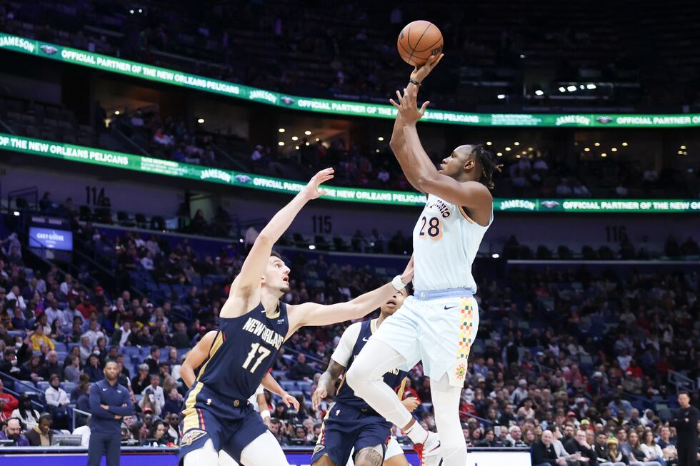San Antonio Spurs center Charles Bassey (28) shoots a one-handed jumper over New Orleans...