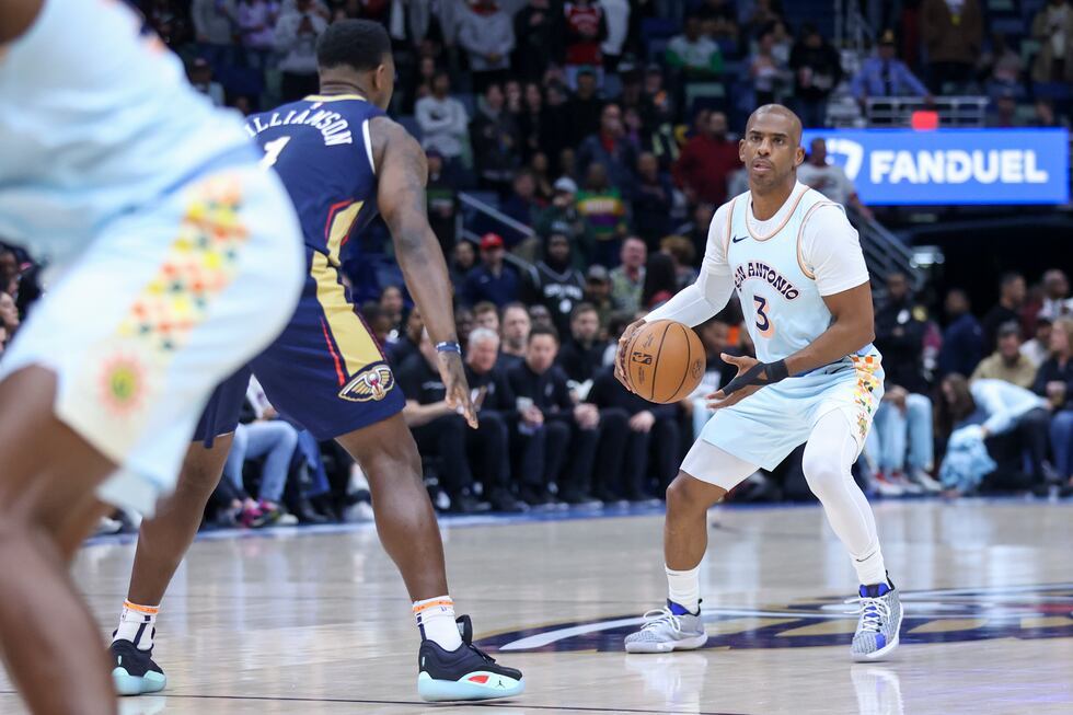 San Antonio Spurs guard Chris Paul (3) brings the ball up the court against New Orleans...