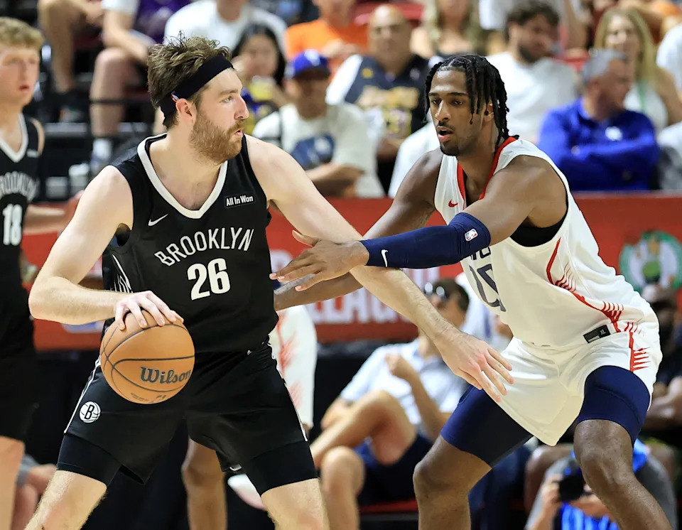 LAS VEGAS, NEVADA - JULY 13: Drew Timme #26 of the Brooklyn Nets is guarded by Alex Sarr #20 of the Washington Wizards in the second half of a 2025 NBA Summer League game at the Thomas & Mack Center on July 13, 2025 in Las Vegas, Nevada. NOTE TO USER: User expressly acknowledges and agrees that, by downloading and or using this photograph, User is consenting to the terms and conditions of the Getty Images License Agreement. (Photo by Ethan Miller/Getty Images)
