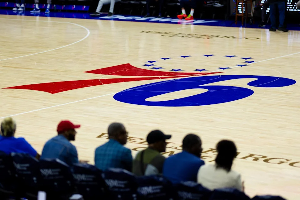 Apr 14, 2024; Philadelphia, Pennsylvania, USA; Philadelphia 76ers logo at center court before a game against the Brooklyn Nets at Wells Fargo Center. Mandatory Credit: Bill Streicher-USA TODAY Sports