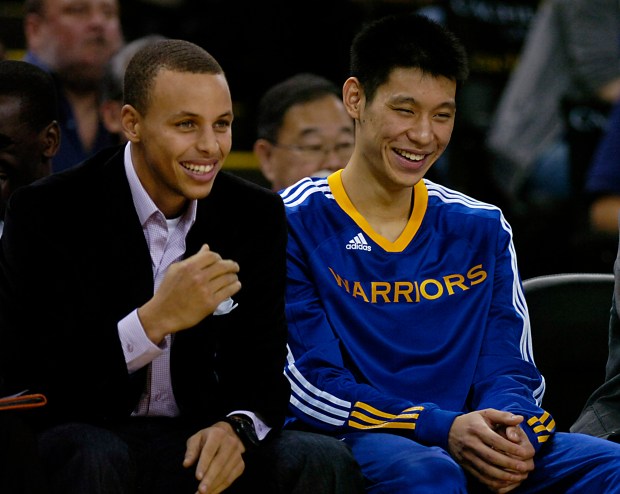 Golden State Warriors Stephen Curry and Jeremy Lin enjoy the view from the bench as their team take on the Grizzlies at Oracle Arena in Oakland, Calif., on Wednesday, Nov. 3, 2010. (Susan Tripp Pollard/Staff)