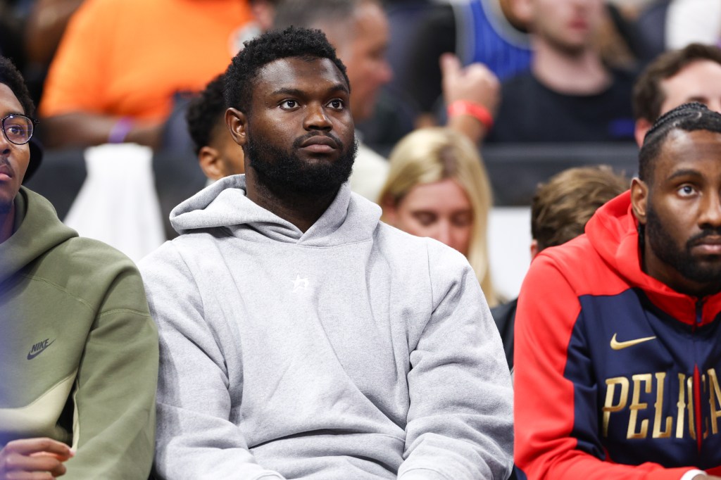New Orleans Pelicans forward Zion Williamson (1) looks on from the bench against the Orlando Magic in the third quarter at Kia Center. 