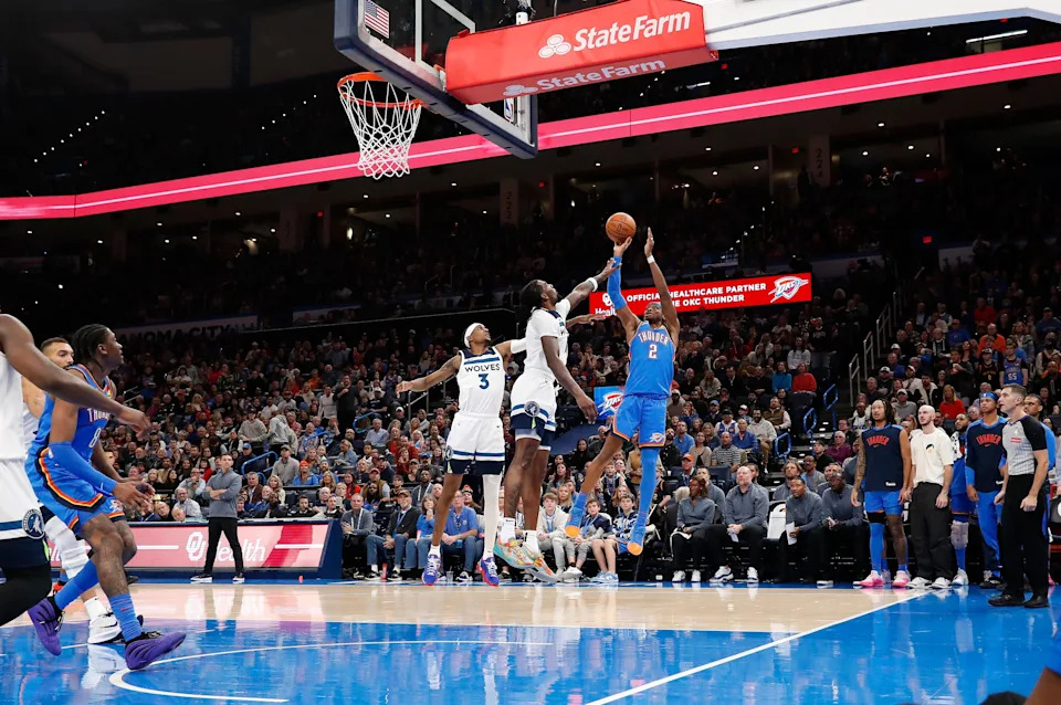 Dec 31, 2024; Oklahoma City, Oklahoma, USA; Oklahoma City Thunder guard Shai Gilgeous-Alexander (2) shoots over Minnesota Timberwolves center Naz Reid (11) during the second half at Paycom Center. Mandatory Credit: Alonzo Adams-Imagn Images