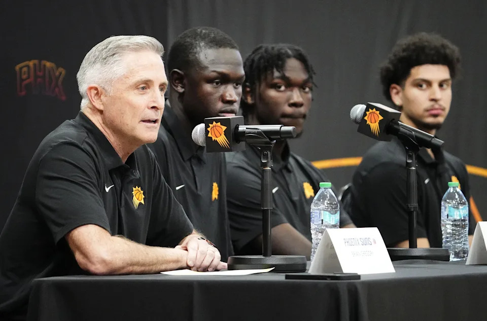 Phoenix Suns general manager Brian Gregory introduces Suns rookies Khaman Maluach, Rasheer Fleming and Koby Brea (right) during a news conference at the Scottsdale/Paradise Valley YMCA on July 7, 2025.