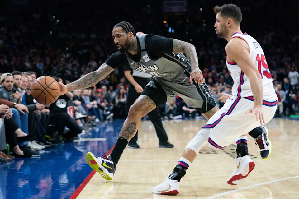 Feb 20, 2020; Philadelphia, Pennsylvania, USA; Brooklyn Nets forward Wilson Chandler (21) lunges to keep the ball in bounds in front of Philadelphia 76ers guard Raul Neto (19) during the fourth quarter at Wells Fargo Center. Mandatory Credit: Bill Streicher-USA TODAY Sports