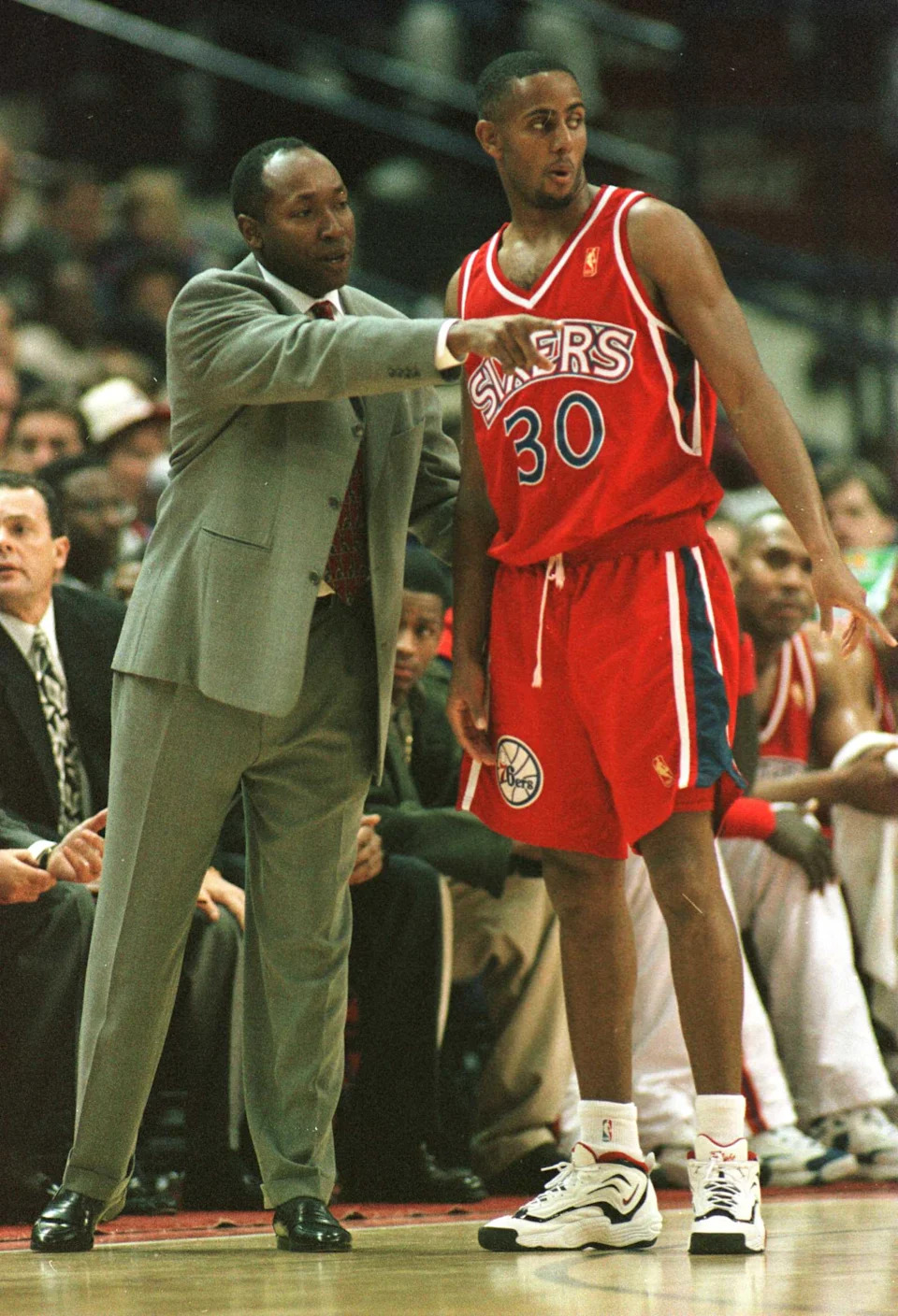 22 Nov 1996: Head Coach Johnny Davis of the Philadelphia 76ers, talks with Lucious Harris #30 as the Washington Bullets posted a 48-35 halftime lead over the 76ers at the US AIr Arena in Landover, Maryland. Mandatory Credit: Doug Pensinger/ALLSPORT