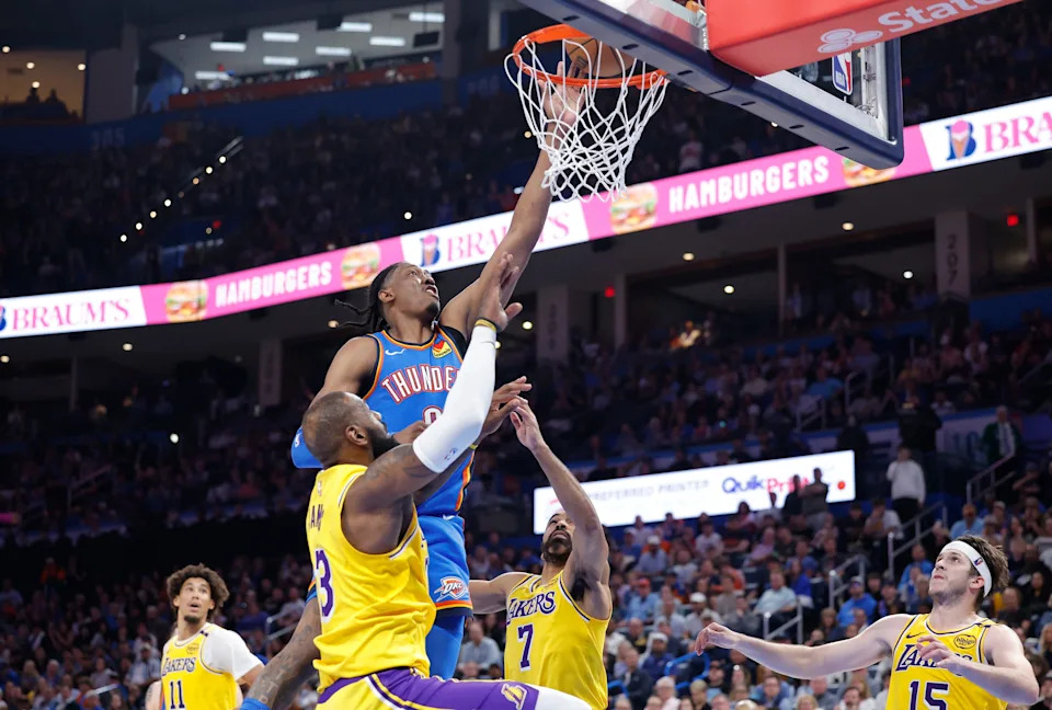 Apr 8, 2025; Oklahoma City, Oklahoma, USA; Oklahoma City Thunder forward Jalen Williams (8) goes up for a basket between Los Angeles Lakers forward LeBron James (23) and guard Gabe Vincent (7) during the second half at Paycom Center. Mandatory Credit: Alonzo Adams-Imagn Images