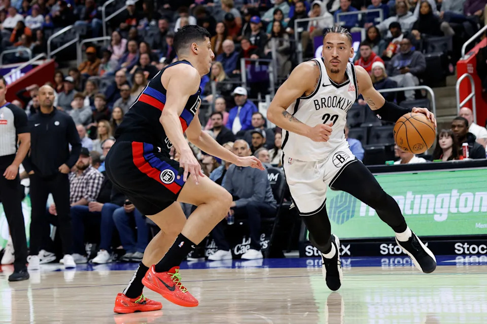 Mar 1, 2025; Detroit, Michigan, USA; Brooklyn Nets forward Jalen Wilson (22) dribbles defended by Detroit Pistons forward Simone Fontecchio (19) at Little Caesars Arena. Mandatory Credit: Rick Osentoski-Imagn Images