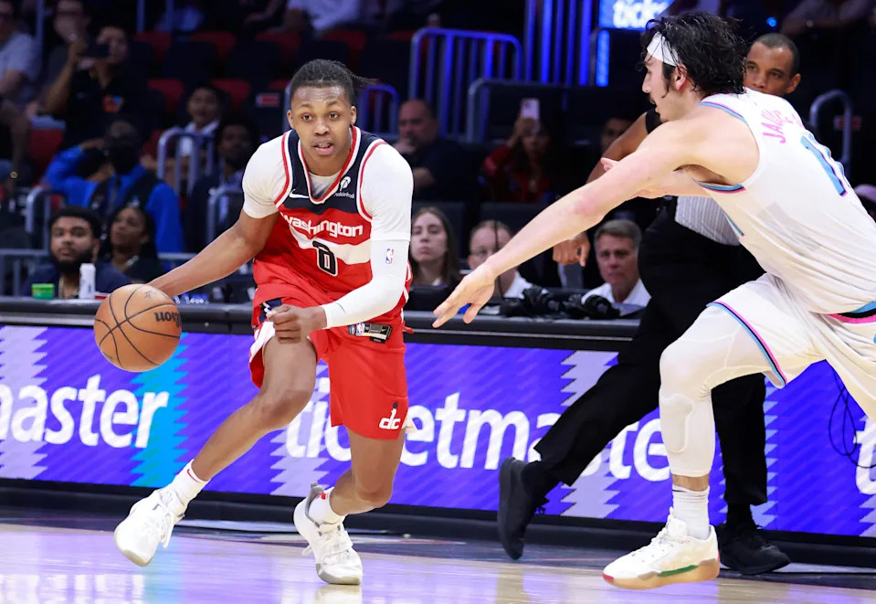 Apr 13, 2025; Miami, Florida, USA; Miami Heat guard Jaime Jaquez Jr. (11) defends Washington Wizards guard Bub Carrington (8) during the second half at Kaseya Center. Mandatory Credit: Rhona Wise-Imagn Images