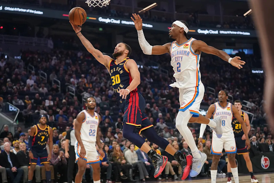 Jan 29, 2025; San Francisco, California, USA; Golden State Warriors guard Stephen Curry (30) misses a layup in front of Oklahoma City Thunder guard Shai Gilgeous-Alexander (2) in the first quarter at the Chase Center. Mandatory Credit: Cary Edmondson-Imagn Images