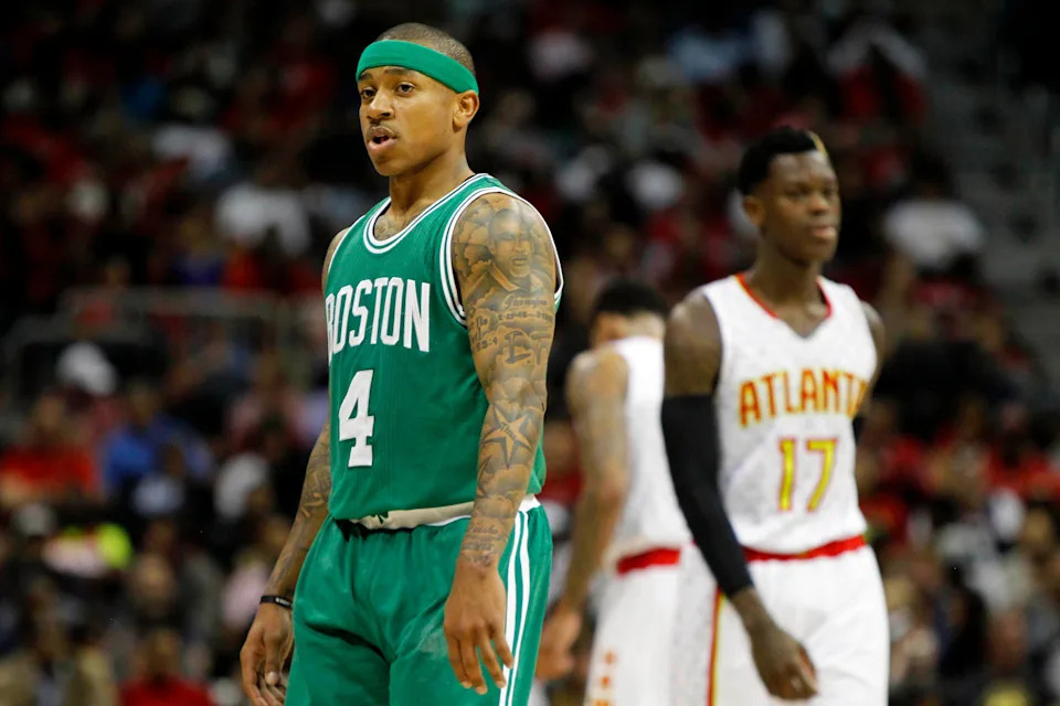 Apr 26, 2016; Atlanta, GA, USA; Boston Celtics guard Isaiah Thomas (4) walks past Atlanta Hawks guard Dennis Schroder (17) in the third quarter in game five of the first round of the NBA Playoffs at Philips Arena. Mandatory Credit: Brett Davis-USA TODAY Sports