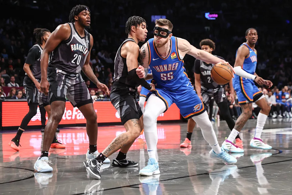 Feb 26, 2025; Brooklyn, New York, USA; Oklahoma City Thunder center Isaiah Hartenstein (55) looks to drive past Brooklyn Nets guard Killian Hayes (7) in the first quarter at Barclays Center. Mandatory Credit: Wendell Cruz-Imagn Images