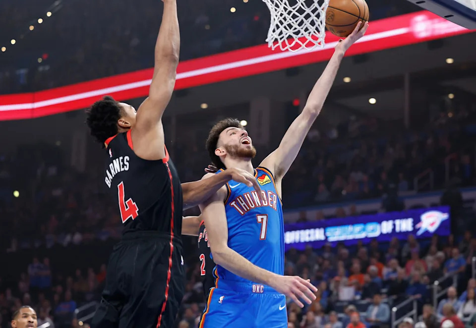 Feb 7, 2025; Oklahoma City, Oklahoma, USA; Oklahoma City Thunder forward Chet Holmgren (7) shoots beside Toronto Raptors forward Scottie Barnes (4) during the first quarter at Paycom Center. Mandatory Credit: Alonzo Adams-Imagn Images