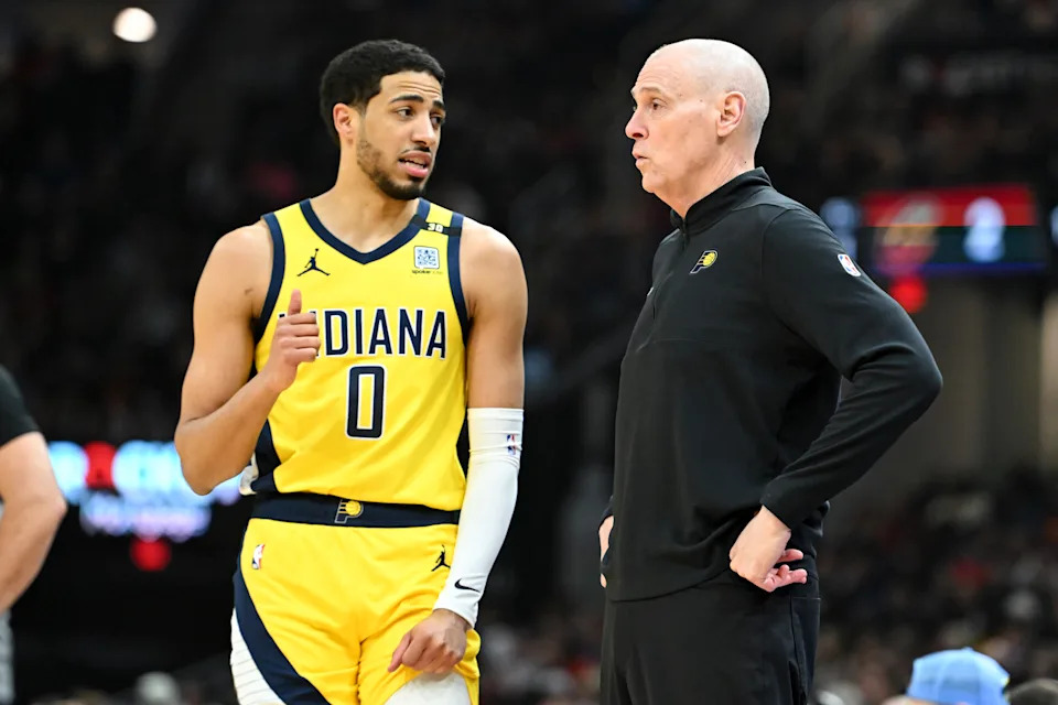 CLEVELAND, OHIO - APRIL 12: Head coach Rick Carlisle of the Indiana Pacers talks with Tyrese Haliburton #0 during the first half against the Cleveland Cavaliers at Rocket Mortgage Fieldhouse on April 12, 2024 in Cleveland, Ohio. NOTE TO USER: User expressly acknowledges and agrees that, by downloading and or using this photograph, User is consenting to the terms and conditions of the Getty Images License Agreement. (Photo by Nick Cammett/Getty Images)