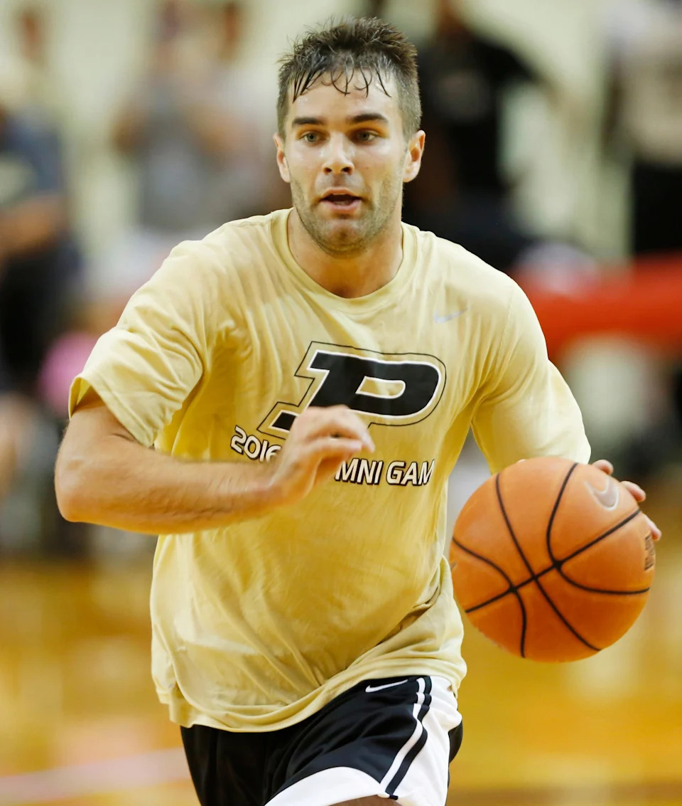 Dru Anthrop of the Gold team brings the ball up court in the Purdue men's alumni basketball game Saturday, August 6, 2016, at Lafayette Jeff's Crawley Center. The Gold team defeated the Black 86-84.