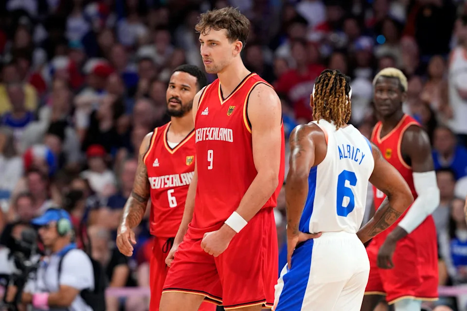 Aug 2, 2024; Villeneuve-d'Ascq, France; Germany guard Franz Wagner (9) reacts after a dunk against France in the second half in a men’s group B basketball game during the Paris 2024 Olympic Summer Games at Stade Pierre-Mauroy. Mandatory Credit: John David Mercer-USA TODAY Sports