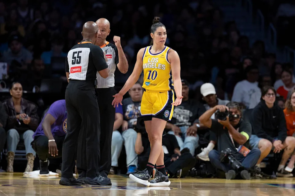 Sparks guard Kelsey Plum questions the official's out-of-bounds call during a game against the Las Vegas Aces.