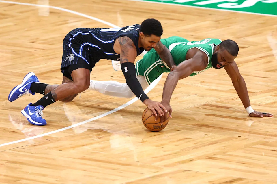 BOSTON, MASSACHUSETTS - APRIL 23: Gary Harris #14 of the Orlando Magic and Jaylen Brown #7 of the Boston Celtics fight for a loose ball during the first quarter in Game Two of the Eastern Conference First Round NBA Playoffs at TD Garden on April 23, 2025 in Boston, Massachusetts. NOTE TO USER: User expressly acknowledges and agrees that, by downloading and or using this photograph, User is consenting to the terms and conditions of the Getty Images License Agreement. (Photo by Maddie Meyer/Getty Images)