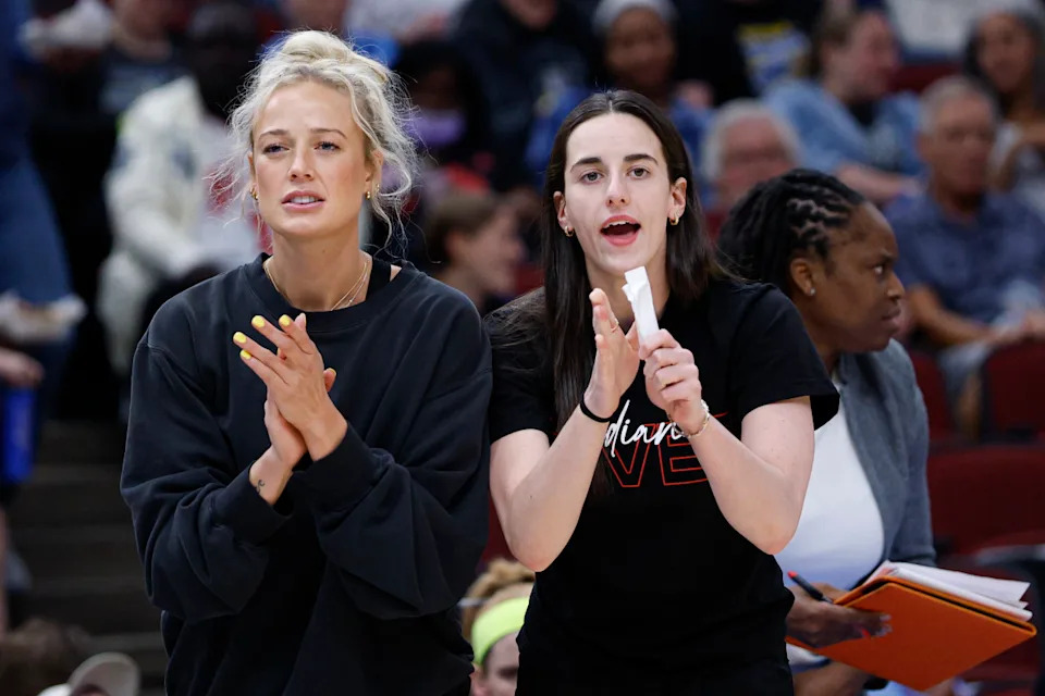 Jun 7, 2025; Chicago, Illinois, USA; Injured Indiana Fever guard Sophie Cunningham (8) and guard Caitlin Clark (22) react from the bench during the first half of a WNBA game against the Chicago Sky at United Center. Kamil Krzaczynski-Imagn Images© Kamil Krzaczynski-Imagn Images