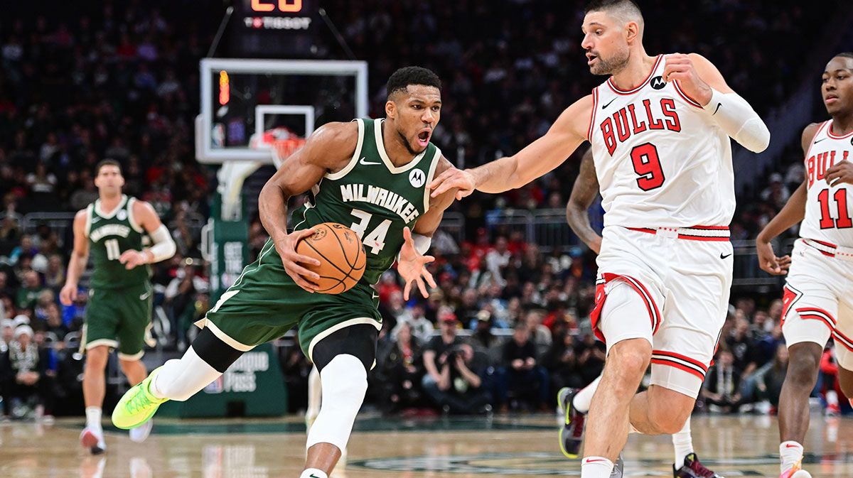 Milwaukee Bucks forward Giannis Antetokounmpo (34) drives for the basket against Chicago Bulls center Nikola Vucevic (9) in the fourth quarter at Fiserv Forum.