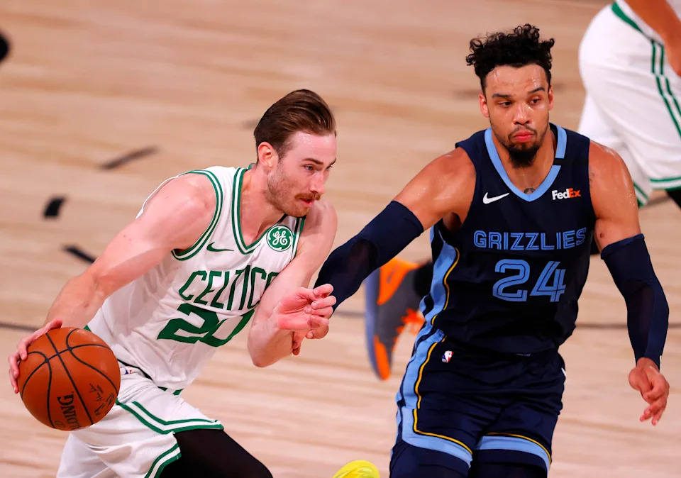 Aug 11, 2020; Lake Buena Vista, Florida, USA; Gordon Hayward #20 of the Boston Celtics drives the ball as Dillon Brooks #24 of the Memphis Grizzlies defends during the fourth quarter at The Arena at ESPN Wide World Of Sports Complex on August 11, 2020 in Lake Buena Vista, Florida. Mandatory Credit: Mike Ehrmann/Pool Photo-USA TODAY Sports