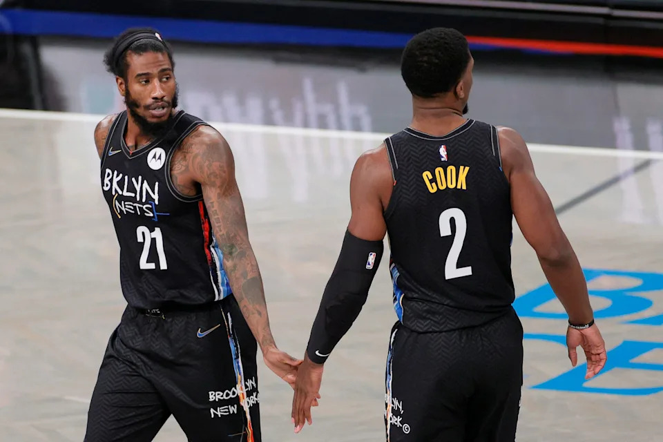 NEW YORK, NEW YORK - FEBRUARY 27: Tyler Cook #2 high-fives Iman Shumpert #21 of the Brooklyn Nets during the second half against the Dallas Mavericks at Barclays Center on February 27, 2021 in the Brooklyn borough of New York City. The Mavericks won 115-98. NOTE TO USER: User expressly acknowledges and agrees that, by downloading and or using this Photograph, user is consenting to the terms and conditions of the Getty Images License Agreement. (Photo by Sarah Stier/Getty Images)
