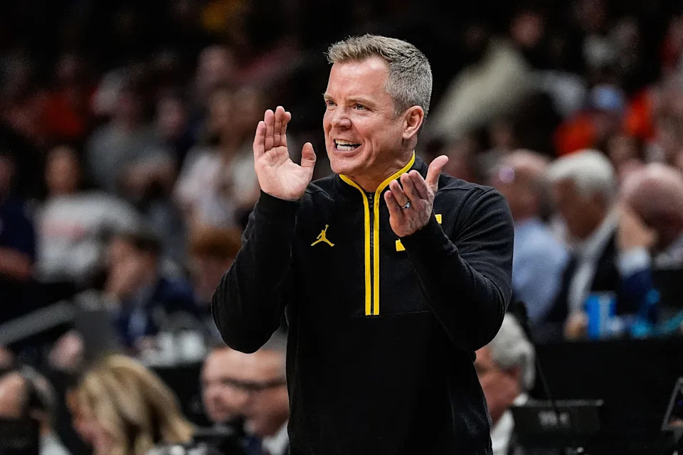 Michigan head coach Dusty May cheers on after a play against Auburn during the second half of the Sweet 16 round of NCAA tournament at State Farm Arena in Atlanta, Ga. on Friday, March 28, 2025.