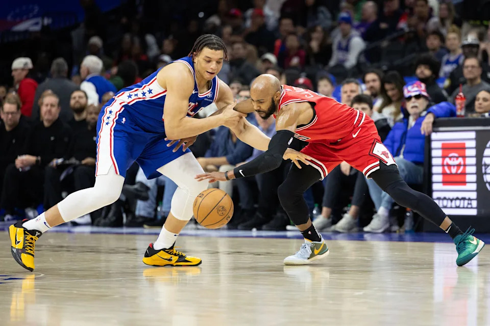 Jan 2, 2024; Philadelphia, Pennsylvania, USA; Philadelphia 76ers Kenneth Lofton Jr. looses the ball to Chicago Bulls guard Jevon Carter (5) during the fourth quarter at Wells Fargo Center. Mandatory Credit: Bill Streicher-USA TODAY Sports