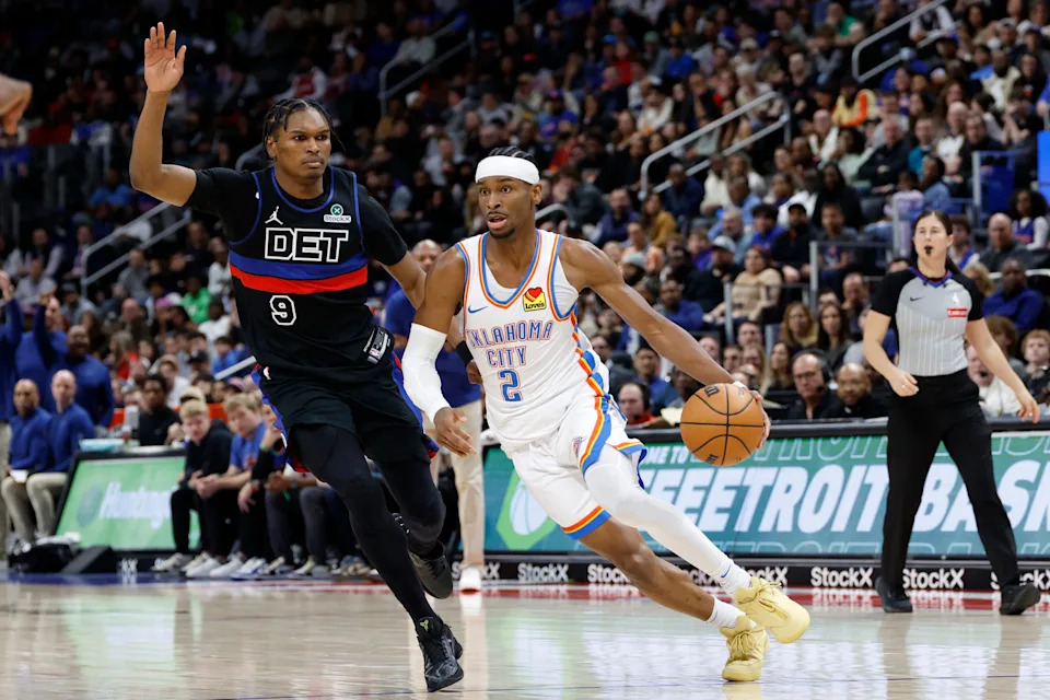Mar 15, 2025; Detroit, Michigan, USA; Oklahoma City Thunder guard Shai Gilgeous-Alexander (2) dribbles on Detroit Pistons forward Ausar Thompson (9) in the second half at Little Caesars Arena. Mandatory Credit: Rick Osentoski-Imagn Images