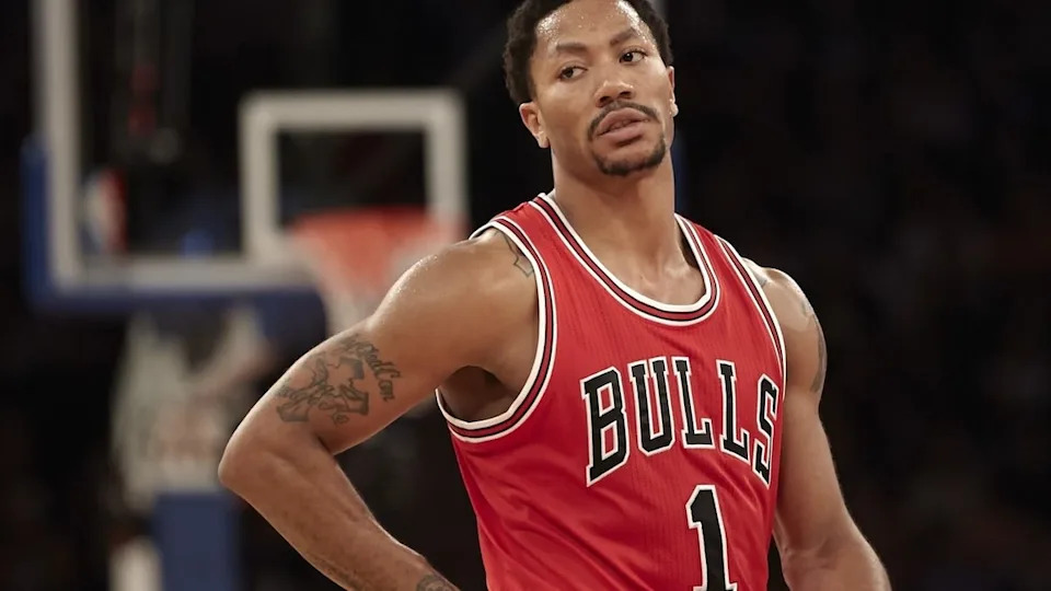 Derrick Rose in a Chicago Bulls uniform on the basketball court, looking focused