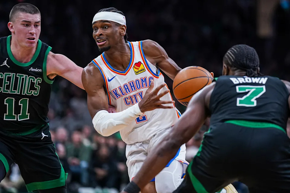 Mar 12, 2025; Boston, Massachusetts, USA; Oklahoma City Thunder guard Shai Gilgeous-Alexander (2) drives the ball against Boston Celtics guard Payton Pritchard (11) and guard Jaylen Brown (7) in the third quarter at TD Garden. Mandatory Credit: David Butler II-Imagn Images