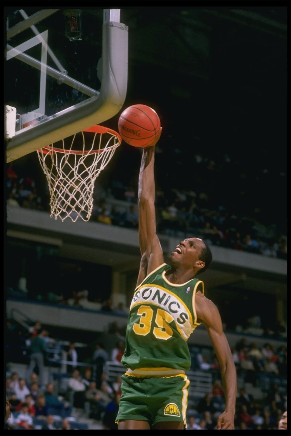 1988-1989: Guard Jerry Reynolds of the Seattle Supersonics goes up to slam dunk during a game against the Milwaukee Bucks. Mandatory Credit: Jonathan Daniel /Allsport