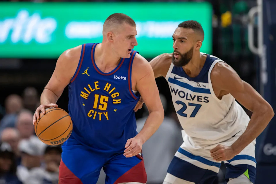 Denver Nuggets center Nikola Jokic (15) controls the ball as Minnesota Timberwolves center Rudy Gobert (27) defends in the second half during game three of the second round for the 2024 NBA playoffs at Target Center. © Jesse Johnson-USA TODAY Sports